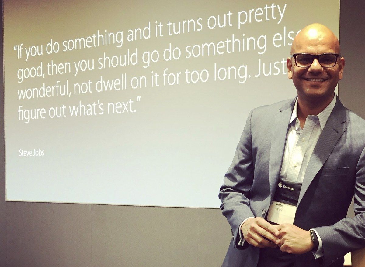 Dr. Peter Maharaj speaking at a technology event